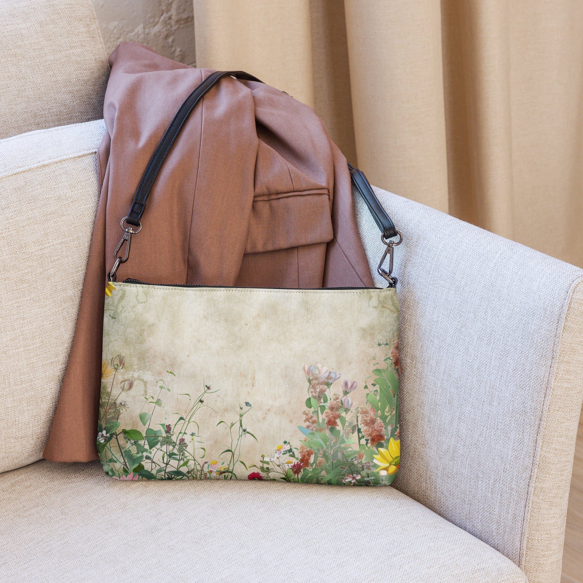 Floral-patterned bag with a brown leather jacket on a beige couch