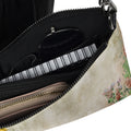 Floral-patterned handbag with a zipper partially open, revealing a black interior.