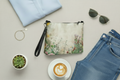 Floral pouch with sunglasses, bracelet, and coffee on a light surface