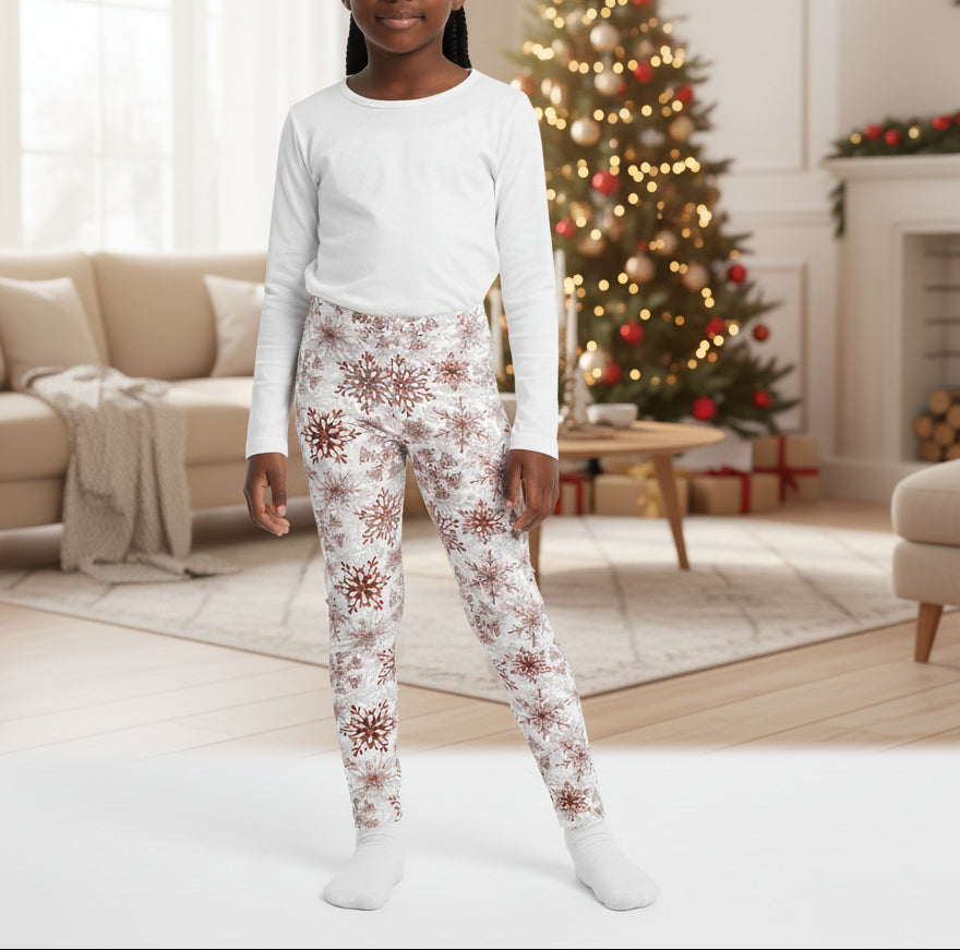Leggings with red snowflake pattern on a white background
