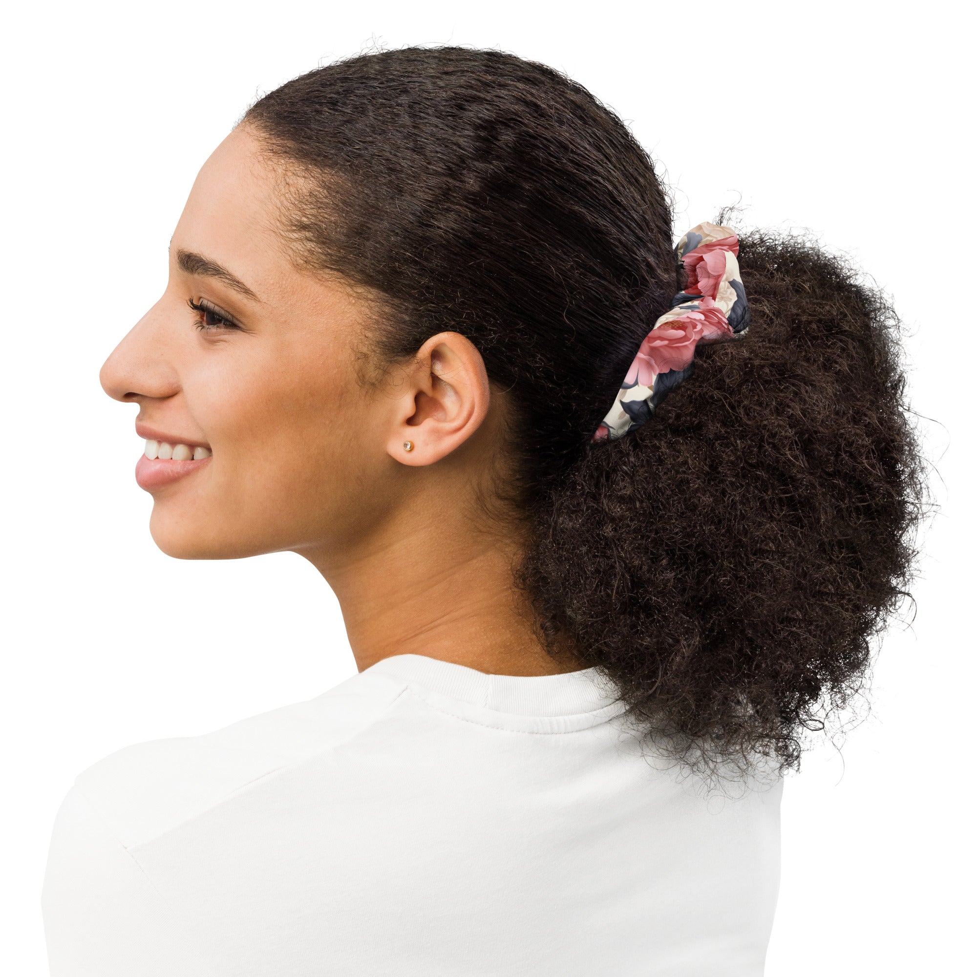Woman with a ponytail wearing a scrunchie on a white background