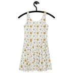 Floral dress on a hanger against a white background