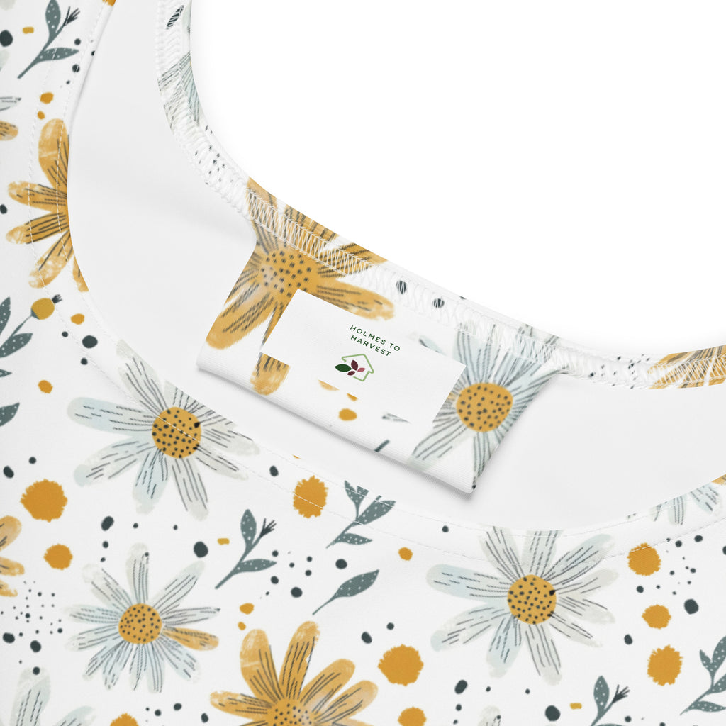 Floral patterned fabric with yellow and white flowers on a white background