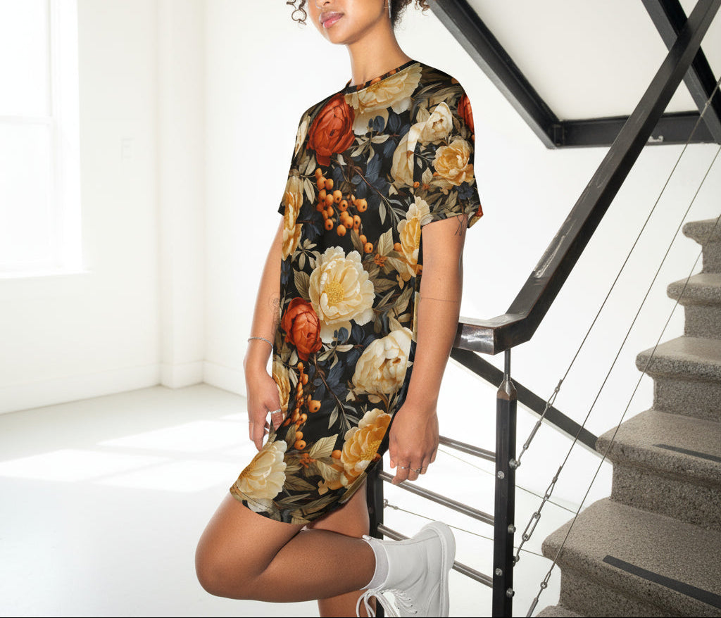 Woman wearing a floral dress standing in a modern interior setting with stairs.