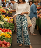 Woman shopping at a farmers market with produce around her