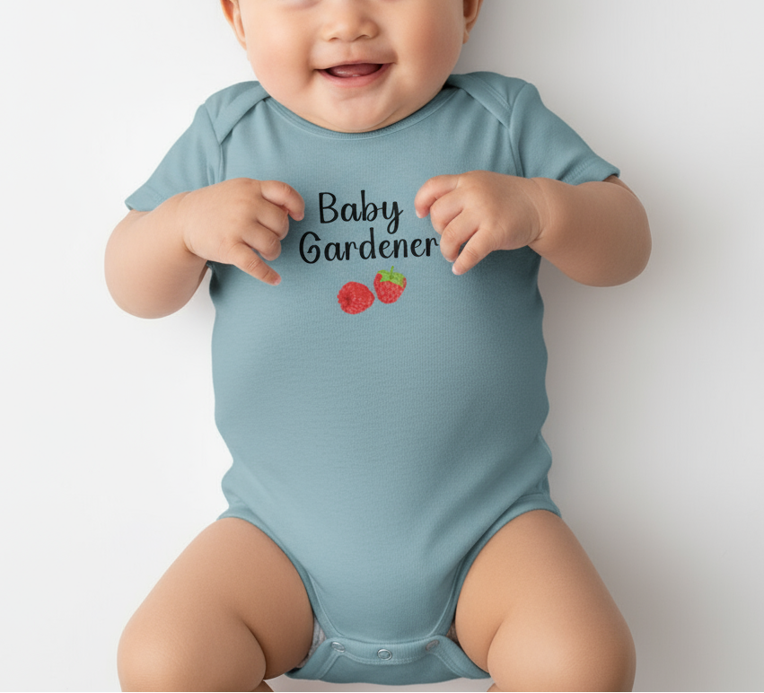 Baby wearing a light blue onesie with 'Baby Gardener' text and tomato graphics on a white background