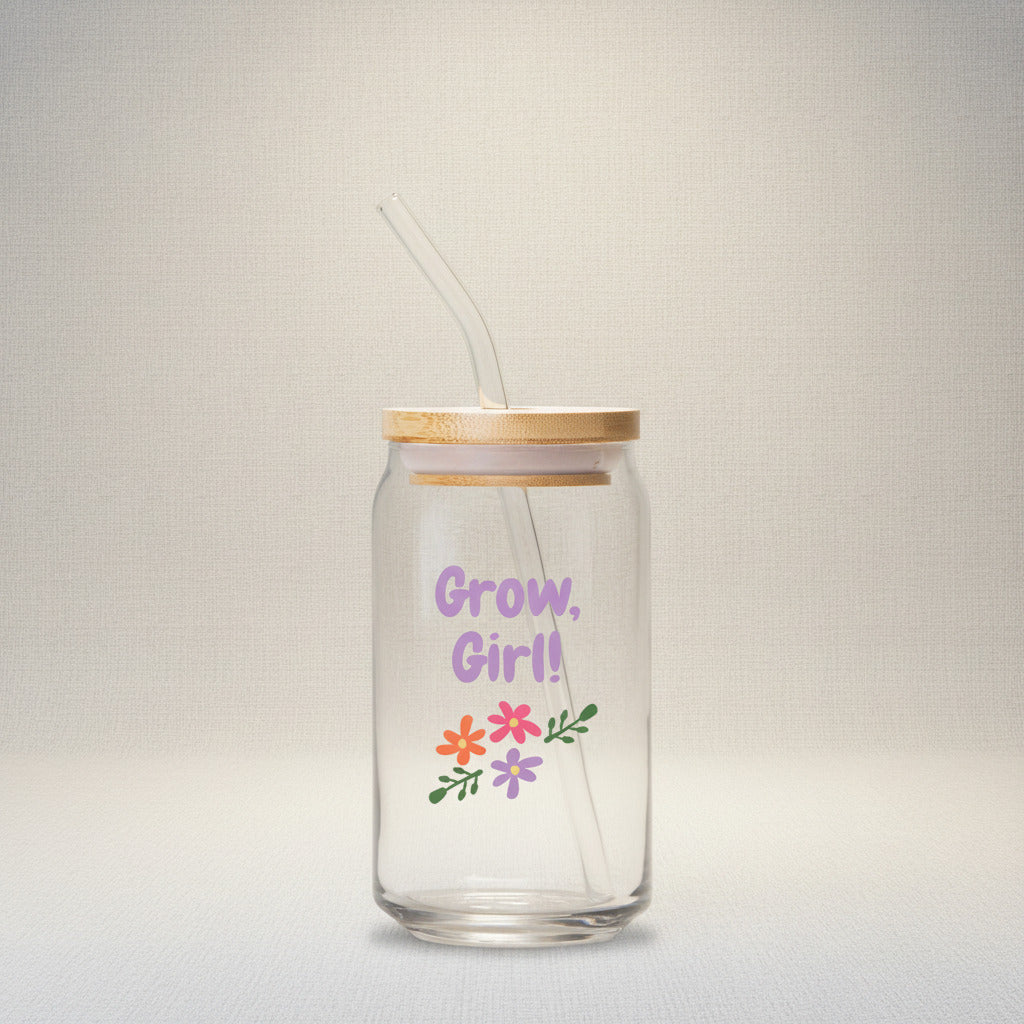 Glass tumbler with straw and wooden lid featuring 'Grow, Girl!' text and floral designs on a white background.