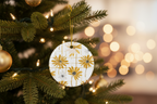 Decorative Christmas ornament with floral design on a tree with blurred lights in the background