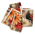 Floral patterned notebooks with orange, red, and beige flowers on a white background