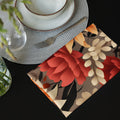Floral patterned napkin on a table with cutlery and a plant.