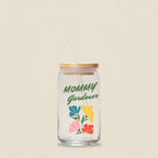 Glass tumbler with straw featuring 'Mommy Gardener' text and colorful floral design on a white background.