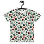 T-shirt with a colorful ball pattern on a hanger against a white background