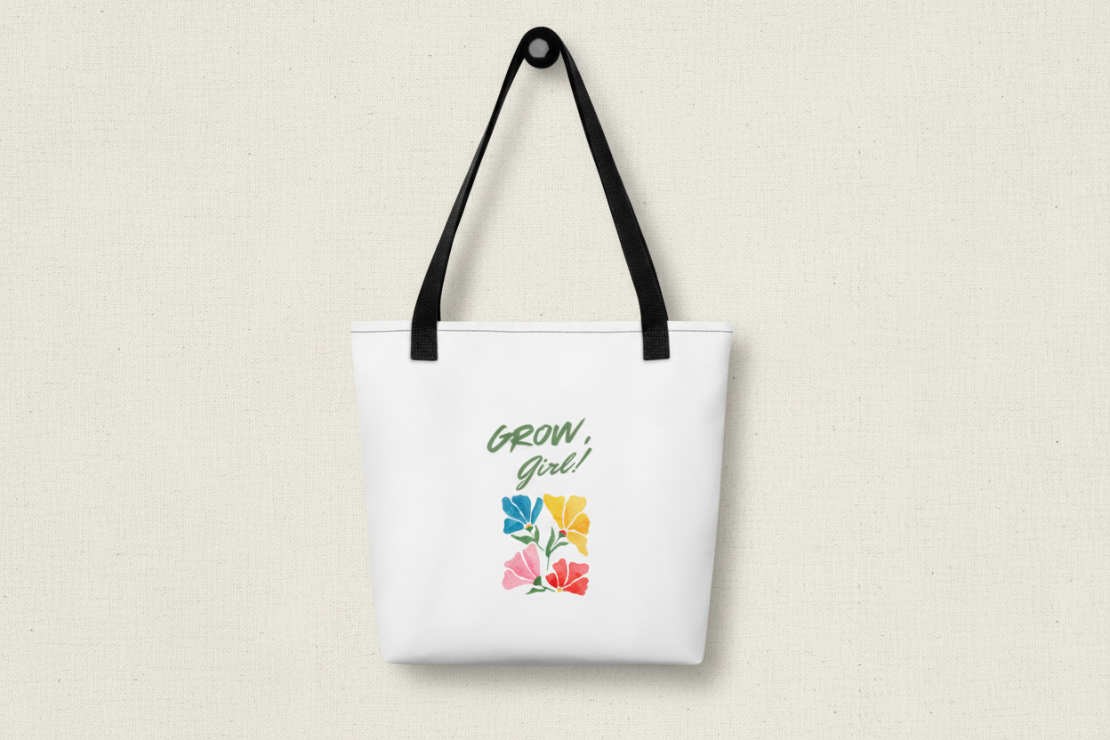 White tote bag with floral design and 'Grow, Girl!' text on a white background