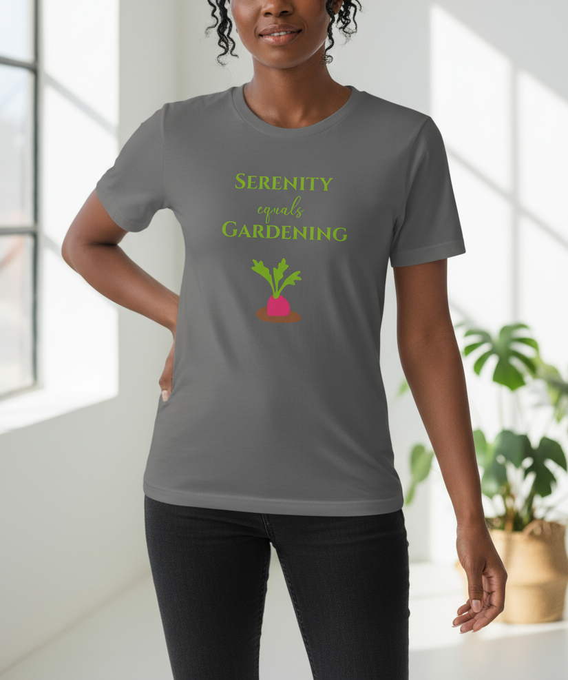 Person wearing a gray t-shirt with a gardening-themed design in a bright room.